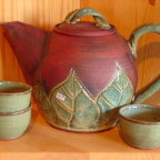 teapot green leaf with tea bowls